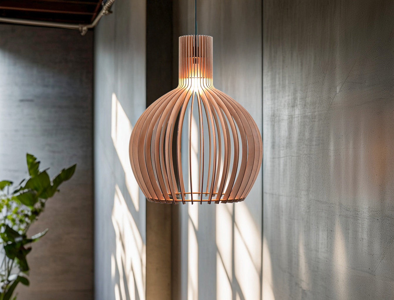 Wooden pendant light hanging against a textured wall with natural light.