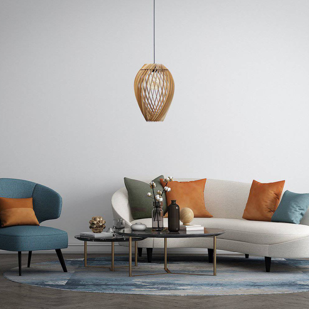 Modern living room with a white sofa, blue armchair, and decorative pillows.